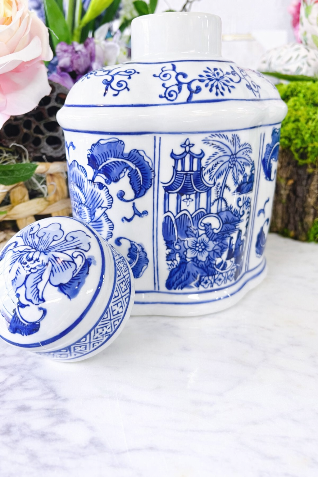Blue and white oval jar with lid