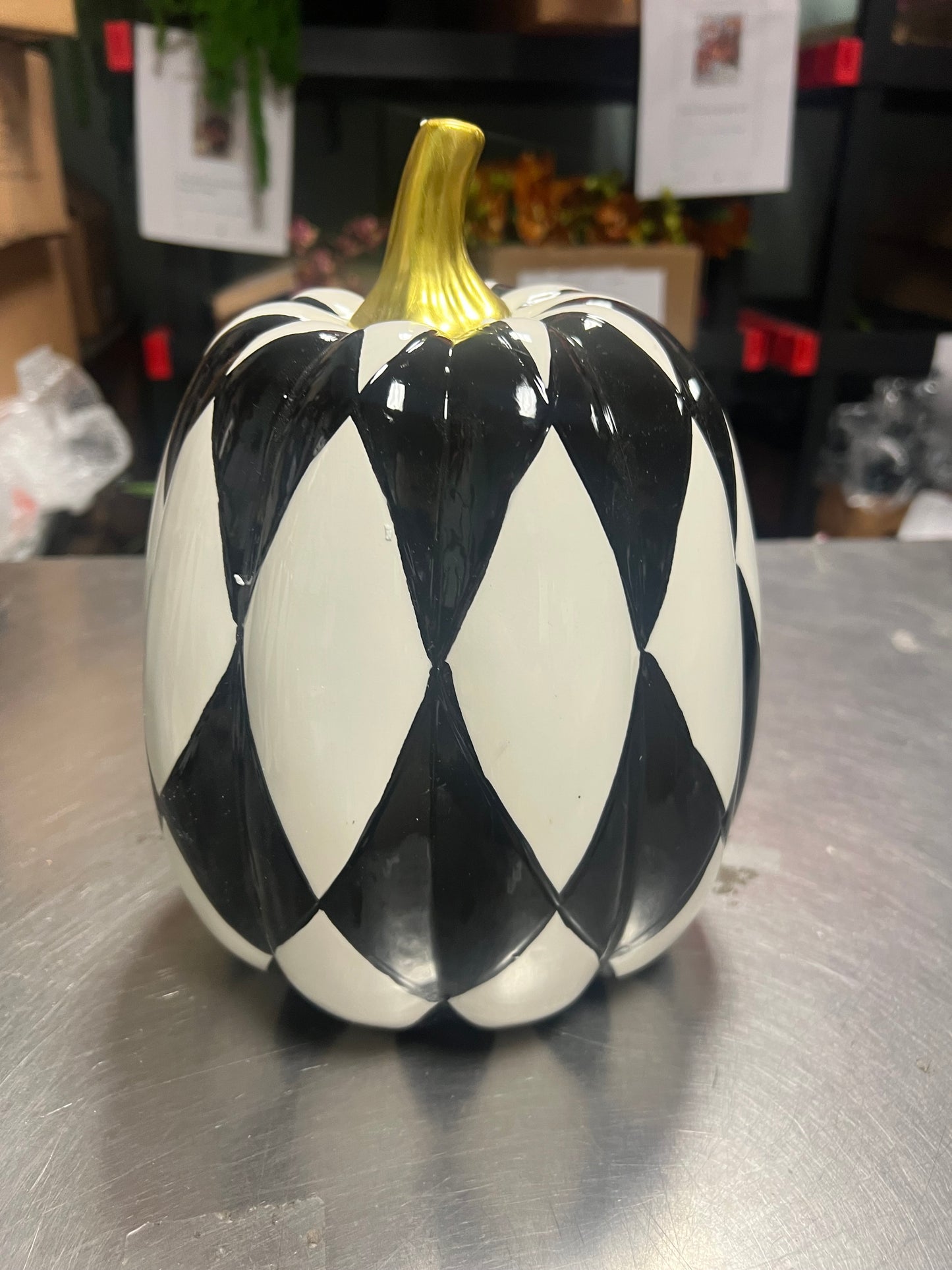 10” Black and white ceramic pumpkin with gold stem