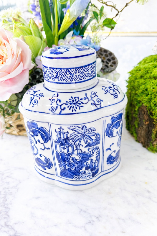 Blue and white oval jar with lid